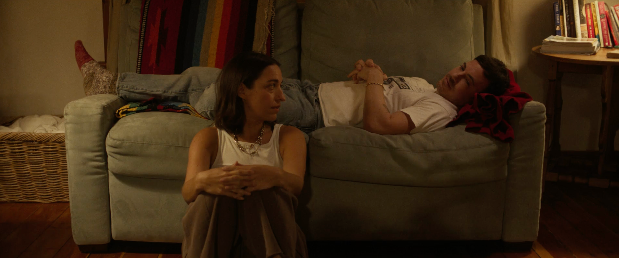 Margot and Julian on the couch inside the Meadow House